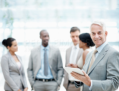 Buy stock photo Portrait, leader and businessman with tablet in business, accountant or pride for career development. Happy, financial advisor and mature person with team, info and research with technology in office