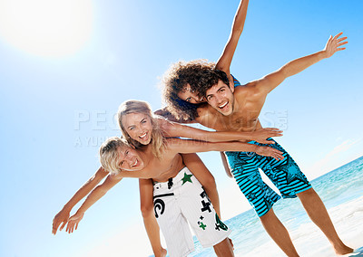 Buy stock photo Piggyback, happy and portrait of friends by ocean for travel, summer holiday and vacation together. Laugh, excited and men with women flying at beach for bonding, fun and tourism for tropical getaway