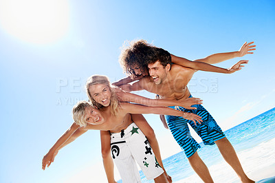Buy stock photo Playful, happy and portrait of friends at beach for travel, summer holiday and vacation together. Laugh, excited and men with women flying by ocean for bonding, fun and tourism for tropical getaway
