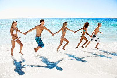 Buy stock photo Waves, running and friends holding hands at beach for summer vacation, holiday and weekend. Happy, space and women with men by ocean for bonding, tourism and travel for island adventure together