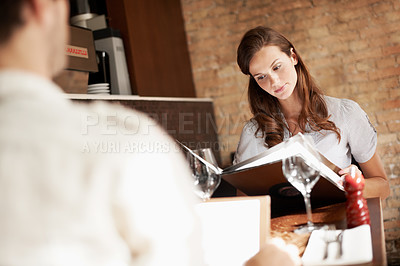 Buy stock photo Woman, date and reading menu at restaurant with choice, care and option on valentines day. Couple, love and together for connection, anniversary or dining with list, wine glass and relationship