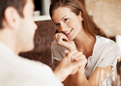 Buy stock photo Couple, date and happy at restaurant while holding hands with love, care and commitment to partner. Woman, man and together for romantic connection, anniversary or dining with smile in relationship