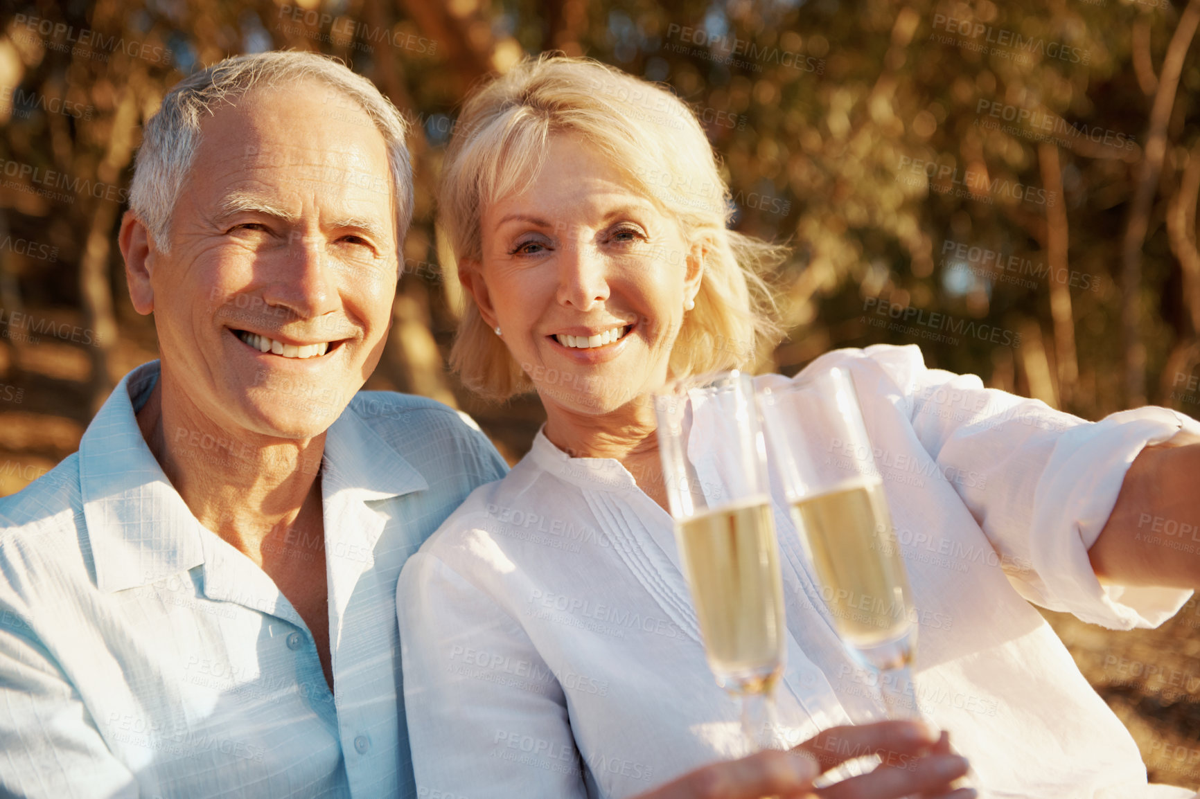 Buy stock photo Portrait, old couple and outdoor with champagne for love, bonding together and trip in healthy relationship. Nature, senior man and woman with wine for travel, marriage and care on weekend holiday
