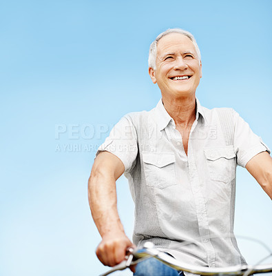 Buy stock photo Happy, elderly man and fitness with bicycle outdoor for wellness, eco friendly transport and space. Smile, senior person and cycling with countryside trip, travel and low angle for retirement