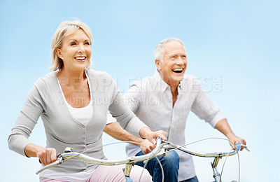 Buy stock photo Love, cycling and freedom with old couple in nature for bonding, weekend break and anniversary vacation. Retirement, holiday and travel with senior man and woman on bicycle outdoor for marriage