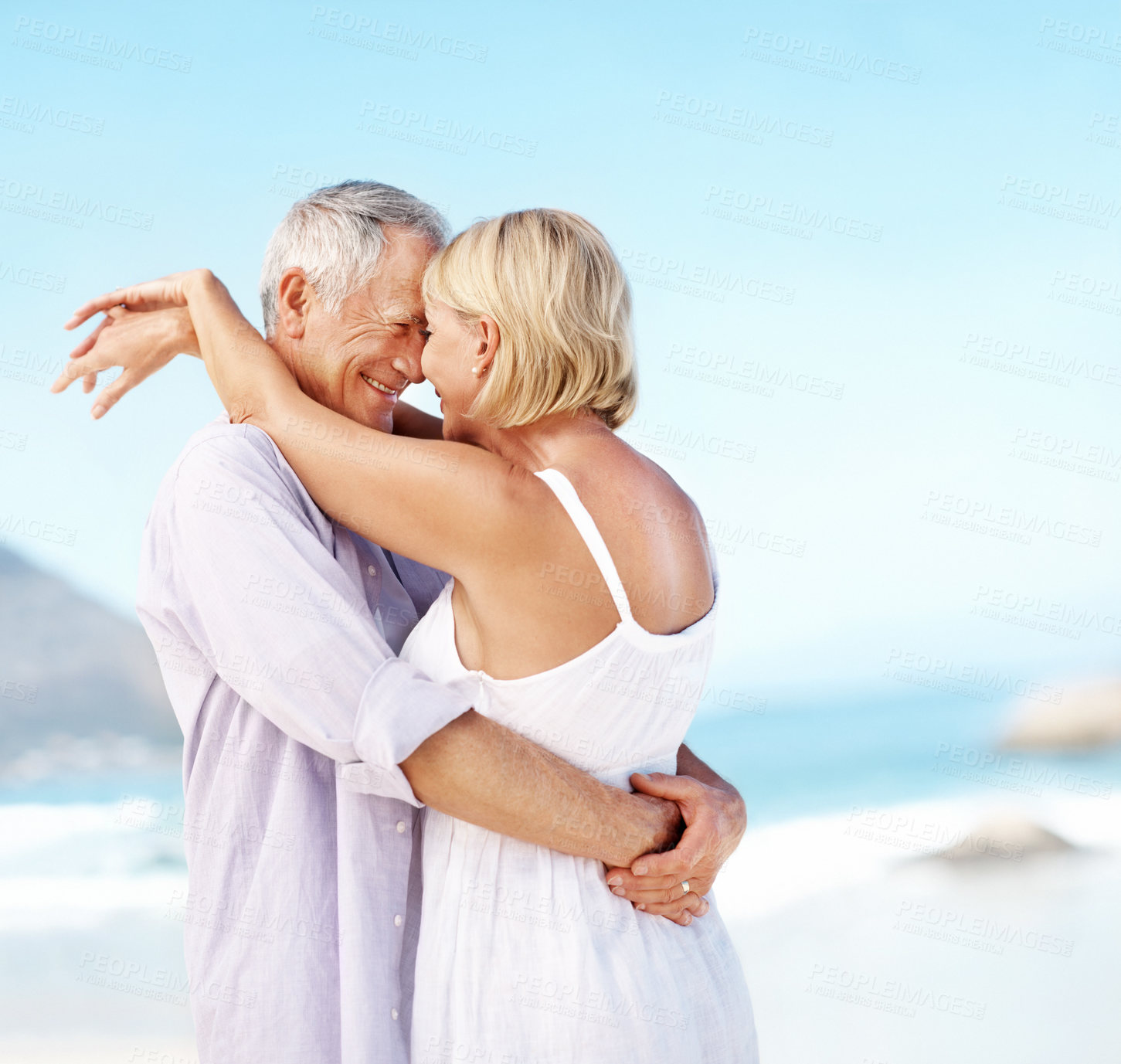 Buy stock photo Holiday, love or elderly couple at ocean with hug, happy moment or connection on summer trip. Trust, space or senior people with forehead touch, romantic relationship or bonding on beach getaway.