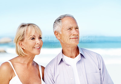 Buy stock photo Mature, couple and smile at beach with summer holiday, support and bonding for romantic getaway. Space, happy married people and relax outdoor by ocean with love, travel and vacation for anniversary.