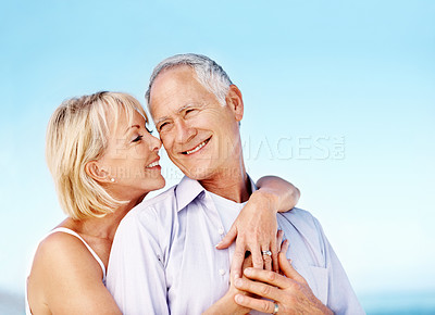 Buy stock photo Smile, hug and couple by beach outdoor on summer vacation, getaway or weekend trip together. Happy, space and mature woman embracing man with safety, bonding or connection in marriage on holiday.