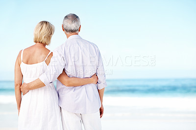 Buy stock photo Back, hug and mature couple by ocean with summer holiday, connection and bonding for romantic getaway. Space, married people and embrace outdoor at beach with love, vacation and trip for anniversary.