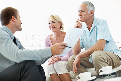 Buy stock photo Senior, couple or home meeting with agent for social security, explain benefits or payout options. Happy, people and financial advisor with paperwork for pension funds, retirement annuity or planning