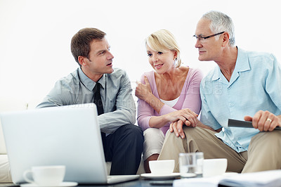 Buy stock photo Finance, elderly couple or advisor in home with laptop, investment review or advice on asset management. Support, old people or wealth consultant with tech, retirement aid or guidance on pension fund