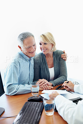 Buy stock photo Senior couple, holding hands and financial advisor in office, happy or listen to retirement strategy. Space, old people and estate planning with wealth manager, explaining and advice with document