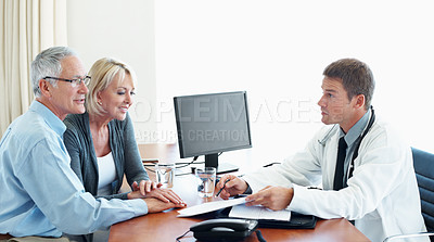 Buy stock photo Doctor, documents and consultation with old couple, medical aid benefits or insurance. Healthcare coverage, happy people and talk with consent form in office, retirement and holding hands for support