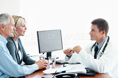 Buy stock photo Doctor, smile and consultation with old couple, healthcare or patient history on white background. Medical worker, people and talking in studio with treatment plan, retirement or happy with results