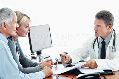 Buy stock photo Hospital, consulting and mature couple with doctor for medical service, health advice and check up. Healthcare, clinic and people with consultant for diagnosis, treatment and wellness with paperwork