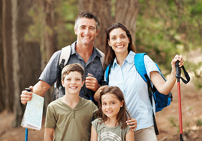 Buy stock photo Backpacking, nature and portrait of family outdoor for adventure, exploring or bonding on holiday. Happy, support and parents with children in forest for hiking on vacation, getaway or weekend trip.