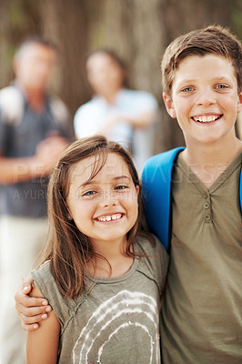 Buy stock photo Portrait, hug and children in nature for hiking, travel adventure and outdoor with family. Parents, siblings and happy boy with girl embrace for fresh air, trekking and bonding on weekend in forest