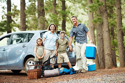 Buy stock photo Portrait, parents and children in nature with camping gear, car and ready for bonding together outdoor. Happy, family and kids holding hands in woods with vehicle, campsite essentials and holiday.