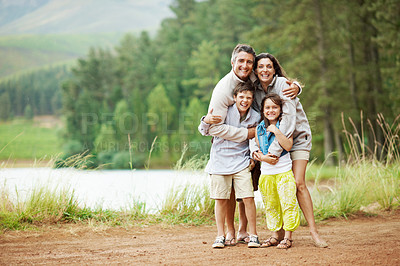 Buy stock photo Happy, nature and portrait of family on holiday, getaway or weekend trip with bonding together. Smile, outdoor and parents with children in forest for adventure, connection or love on vacation.