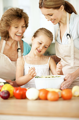 Buy stock photo Salad, grandmother and girl with mom in kitchen for learning, meal prep and help with lunch. Home, generations and happy child with ingredients, vegetables and healthy dinner with family together