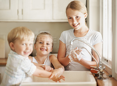Buy stock photo Happy, portrait and kids in bathroom washing hands for hygiene, wellness and cleaning with siblings. Family, home and girls and boy by sink for soap, foam and disinfection for germ prevention