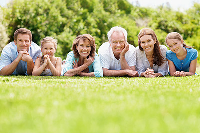 Buy stock photo Portrait, family and parents in park with kids, relax together or generations bonding on weekend break. Space, happy mature people and grandma outdoor on grass with grandfather, children or wellness.