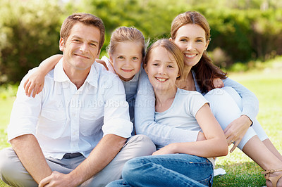 Buy stock photo Portrait, parents and kids in park with hug, relax together and smile for family connection on weekend. Happy people, mother and father chill outdoor with children, embrace and good mood for bonding.
