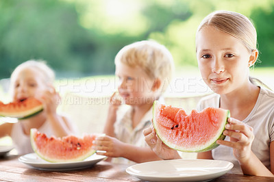 Buy stock photo Girl, portrait and children with watermelon in backyard for healthy snack, food and eating in summer. Family, siblings and happy kids with fruit for wellness, diet and nutrition for weekend outdoor
