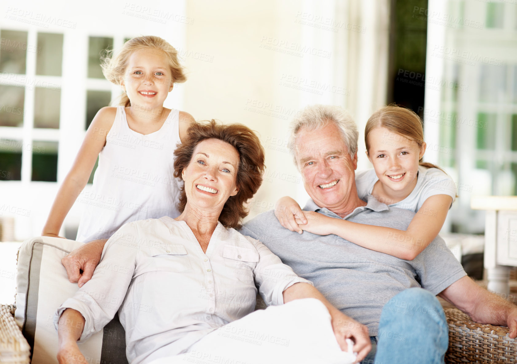 Buy stock photo Grandparents, children and smile portrait in home for care, babysitting weekend and belonging. Happy, senior people and grandkids with love for family security, relationship development and bonding