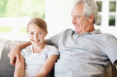 Buy stock photo Calm, smile and grandfather with child on sofa in home for bonding, support and connection. Love, family visit and weekend break with senior man and kid in apartment for portrait, happy and care