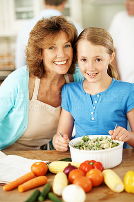 Buy stock photo Portrait, grandmother and child in kitchen with cooking, family gathering or smile for healthy food. Happy, mature woman and girl grandchild in home with meal prep, help and learning for development.