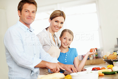 Buy stock photo Kitchen, parents and portrait of child for cooking, bonding and help for family lunch on weekend. Happy, love and girl with home with mom, dad and vegetables for meal prep, healthy dinner and salad