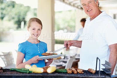 Buy stock photo Barbecue, portrait and grandfather with girl in home for cooking, smile and family celebration. Bbq reunion, summer vacation and grill with people in backyard of house for weekend break and support