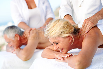 Buy stock photo Woman, couple and massage at spa with smile, romantic anniversary date or stress relief for wellness. Happy, married mature people and relax at resort outdoor with masseuse, body care or calm weekend