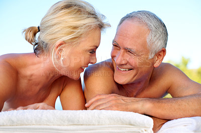 Buy stock photo Smile, massage and old couple in outdoor spa for holiday, retirement and marriage anniversary. Love, luxury resort and happy elderly woman with senior man for stress relief, vacation and hospitality
