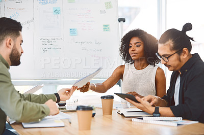 Buy stock photo Shot of a group of young businesspeople having a meeting in a modern office
