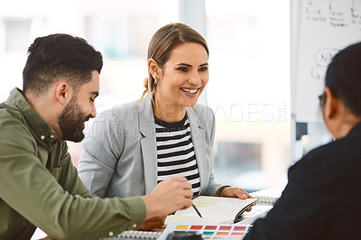 Buy stock photo Shot of a group of young businesspeople having a meeting in a modern office