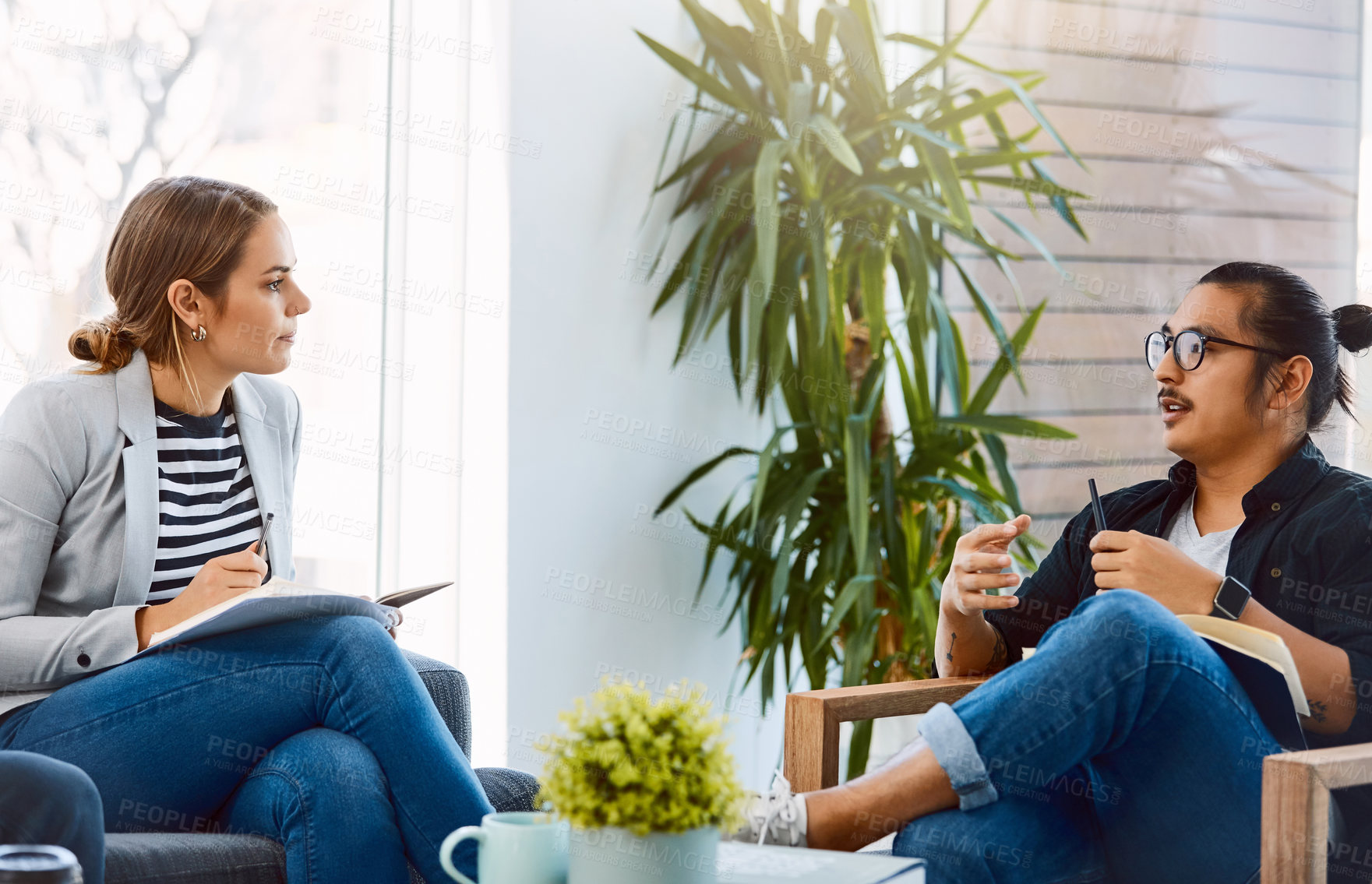 Buy stock photo Creative, people and talking in meeting with notebook, discussion and story ideas for breaking news. Team, chat and editor in office with document, upcoming article and interview source for headline
