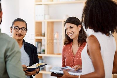 Buy stock photo Shot of a group of young businesspeople having a meeting in a modern office