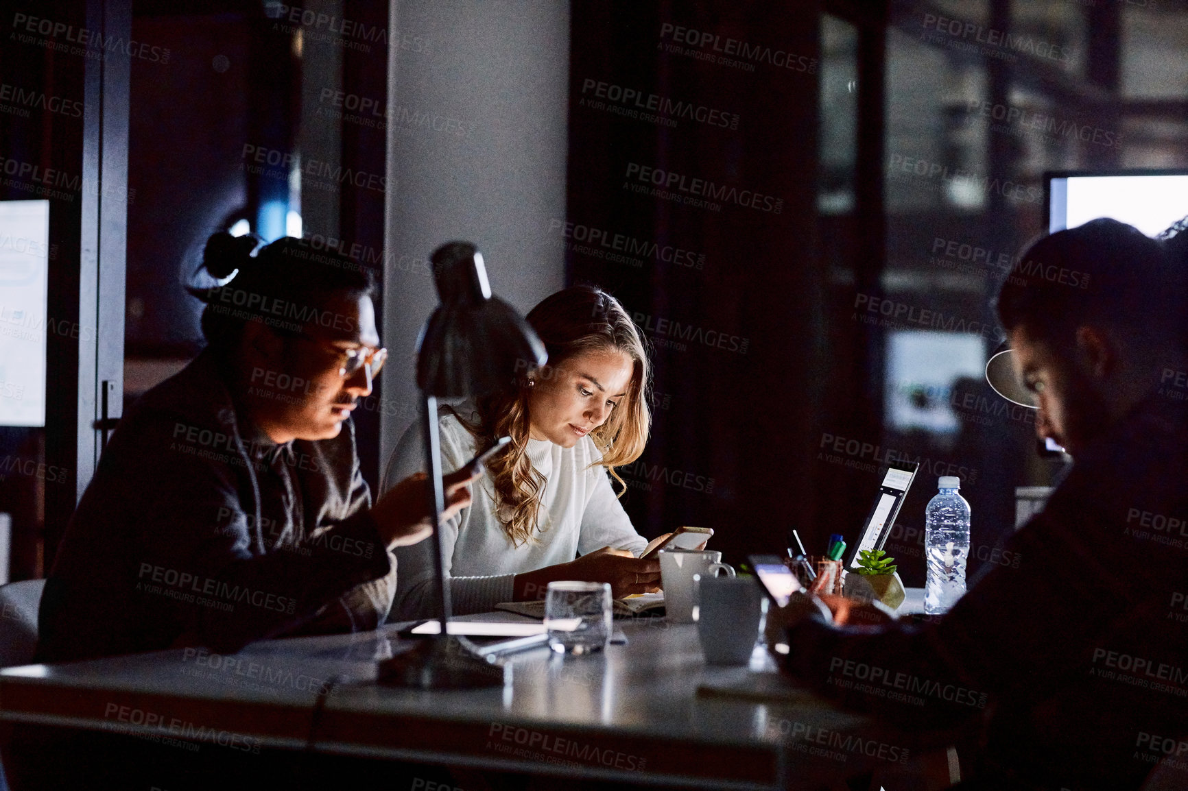 Buy stock photo People, night and meeting with phone in office for business deadline, online project or connection. Group, employees or designers working late with technology for software development or programming