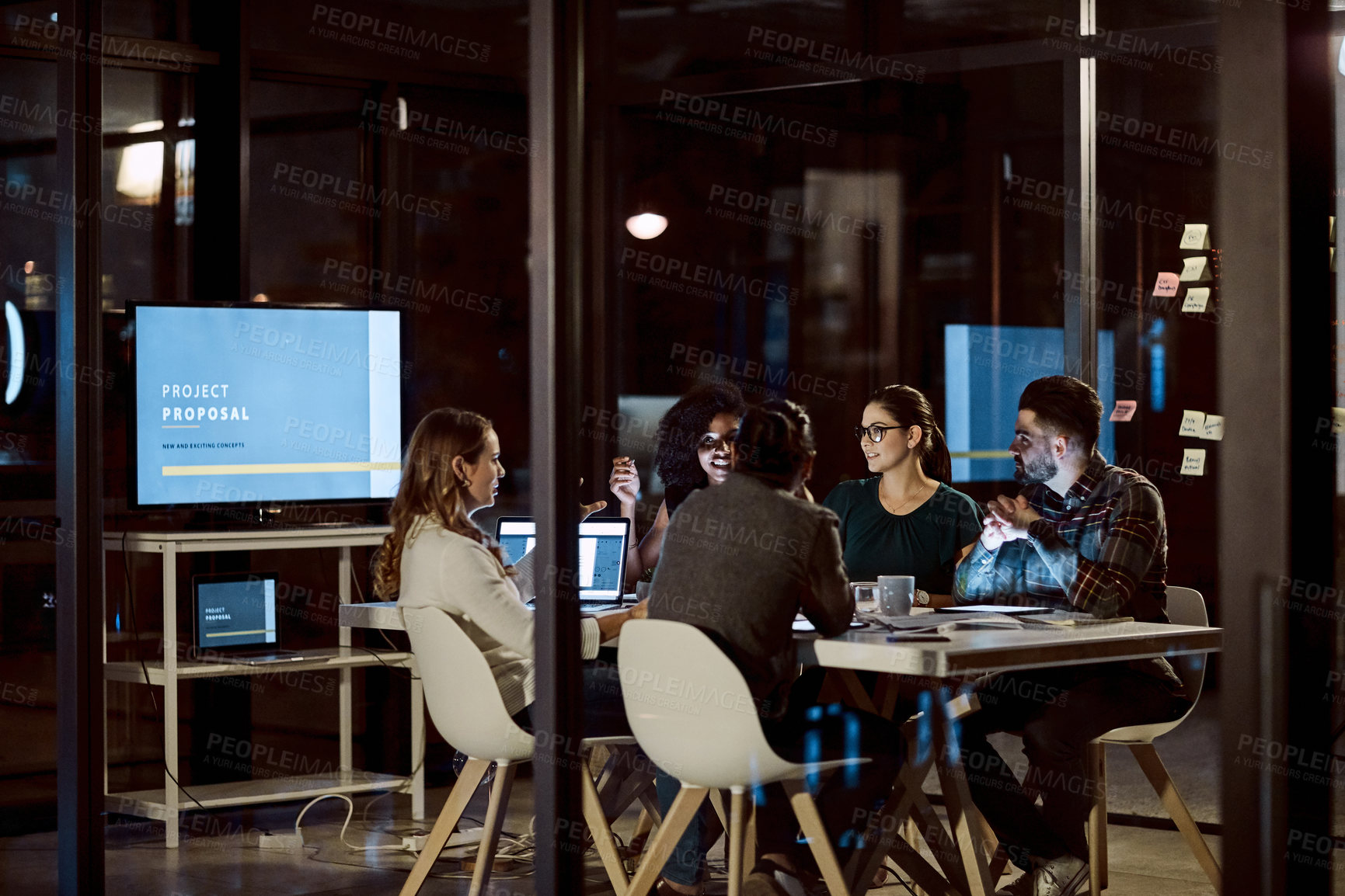 Buy stock photo Business, ideas and group with laptop at night, discussion and collaboration for marketing strategy. Colleagues, working late and teamwork for campaign, graphs and happy people with tech in agency