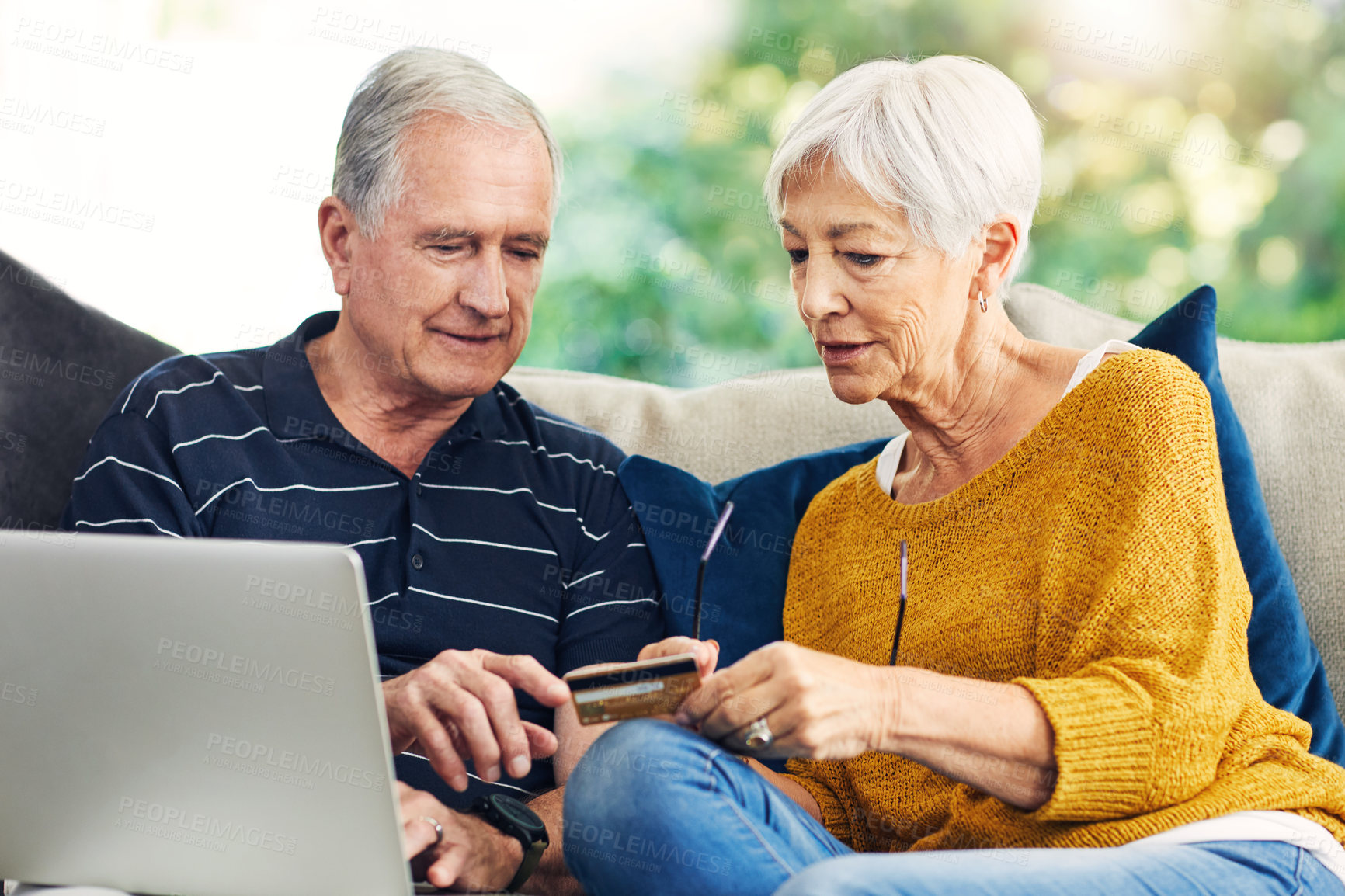 Buy stock photo Talk, laptop and elderly couple in home with credit card, event ticket sale and reservation slot. Fintech, senior people and relax with ticketing app to secure concert seat, easy checkout or support