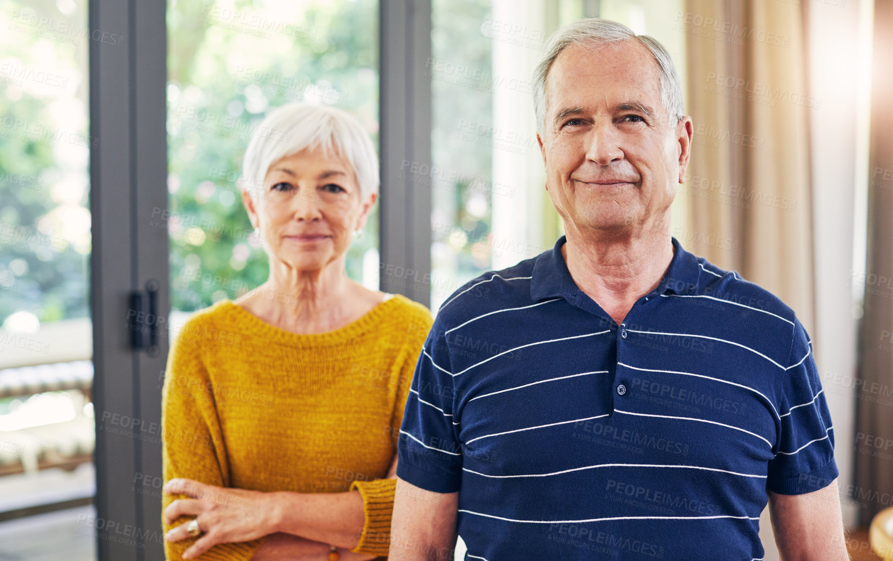 Buy stock photo Smile, old couple and portrait in home for real estate, property investment or mortgage together. Arms crossed, elderly people and commitment for retirement security, purchase or homeownership