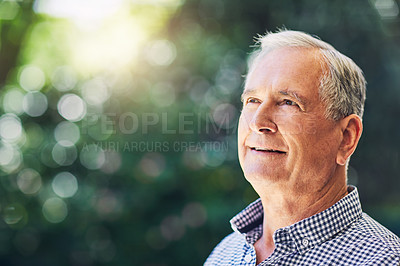 Buy stock photo Shot of a confident senior man looking thoughtful outdoors