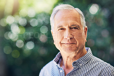 Buy stock photo Shot of a confident senior man standing outdoors