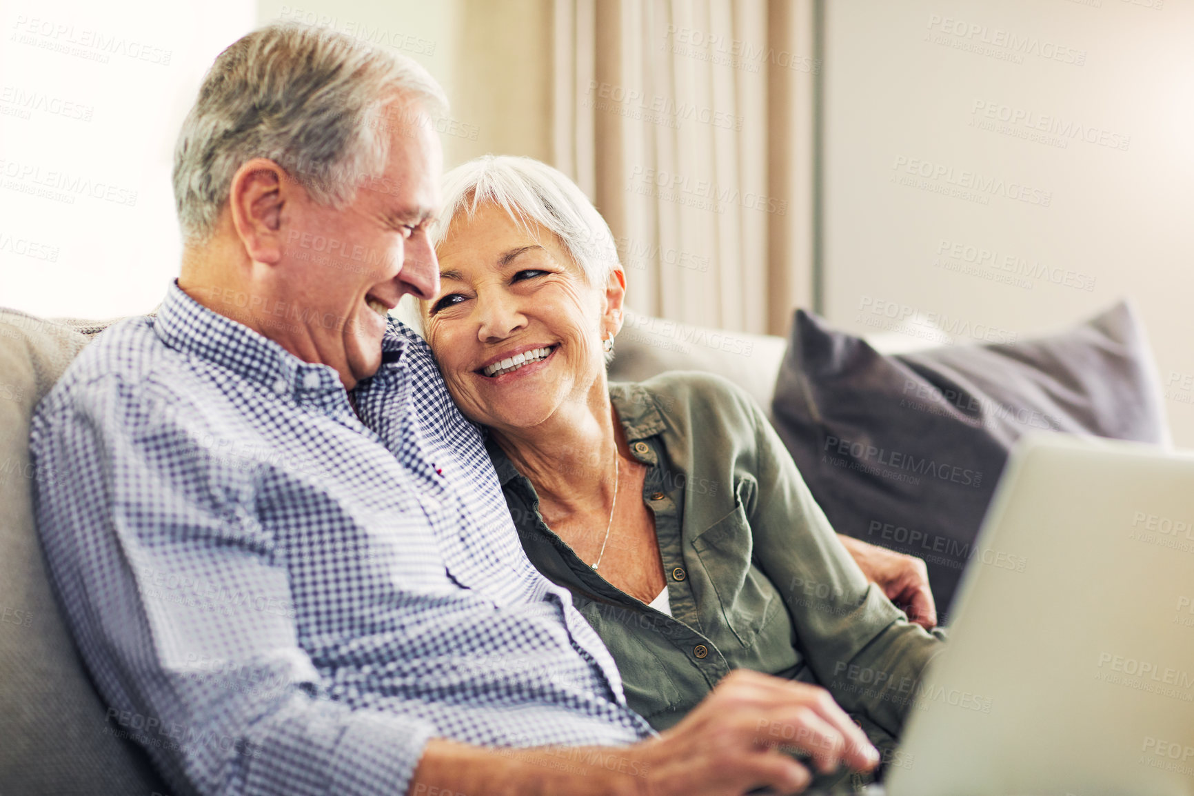Buy stock photo Laptop, smile and old couple on sofa for movie, streaming show or film together in living room. Love, technology and elderly man with woman in retirement for bonding, video and subscription in home