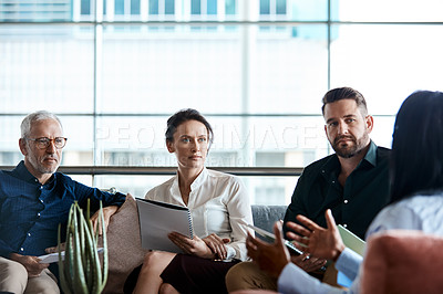 Buy stock photo Shot of a group of businesspeople having a meeting together at work