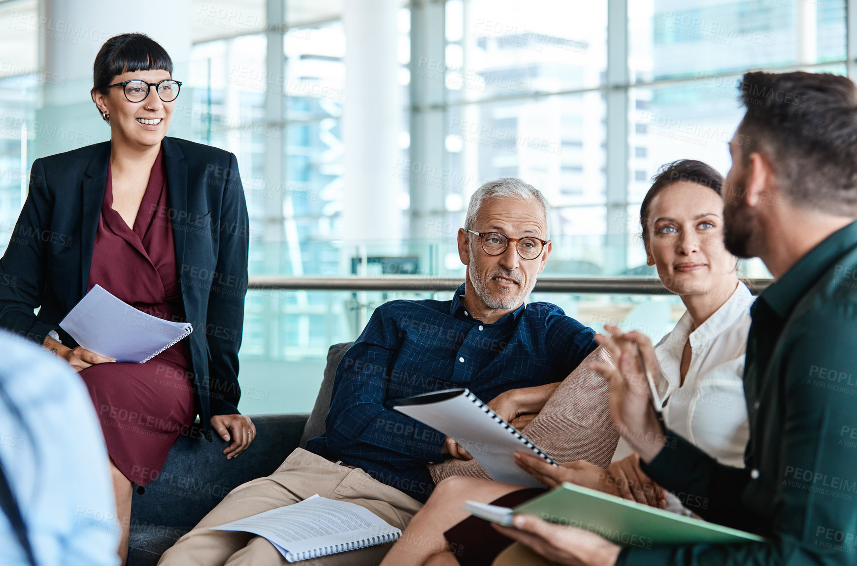 Buy stock photo Shot of a group of businesspeople having a meeting together at work