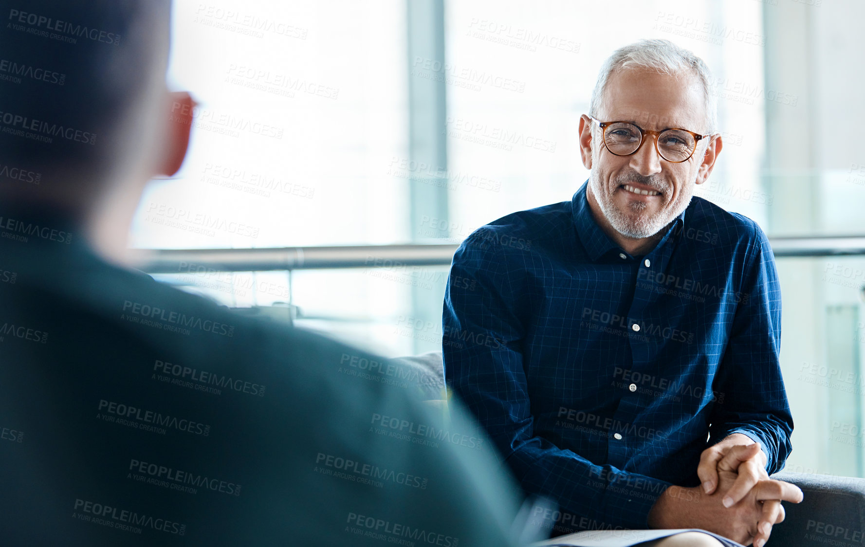 Buy stock photo Businessman, smile and meeting in lobby for partnership, collaboration and project review. Networking, office and mature manager with employee for conversation with b2b deal, support or feedback