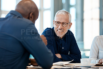 Buy stock photo Shot of a group of businesspeople during a boardroom meeting at work